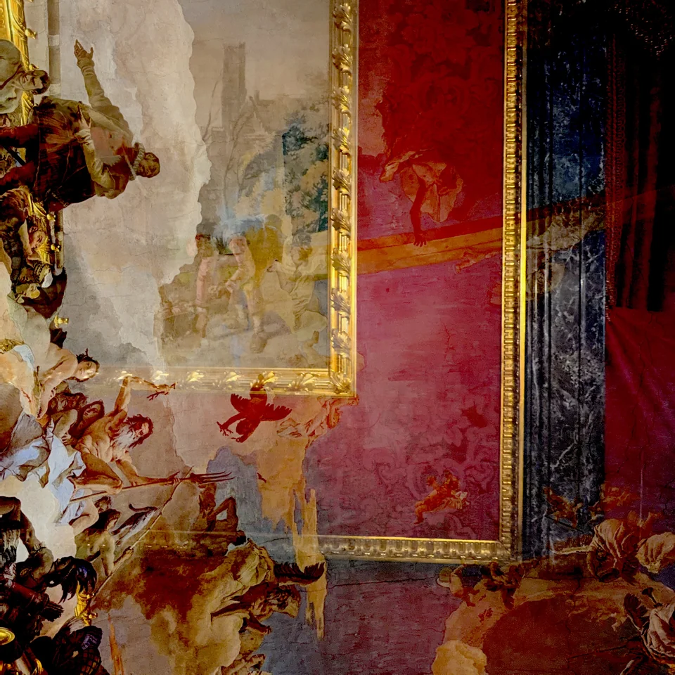 Gilded ornament layered over red and blue interior details.