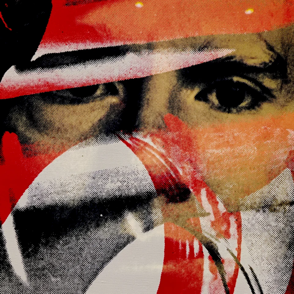 A face layered with red, black, and white abstract shapes.